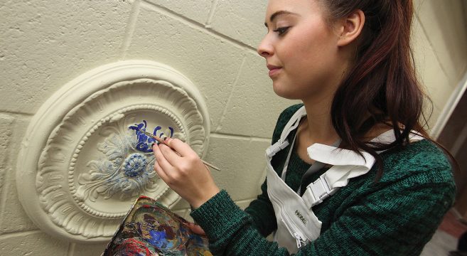 Female Painting & Decorating student practising decorative finishing techniques