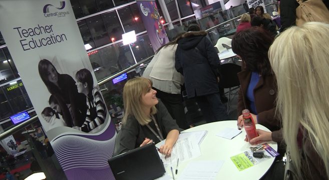 Lecturer talking to open evening visitors