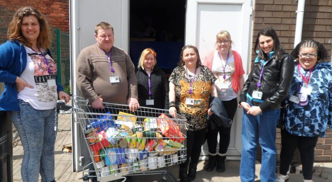 Foundation Learning students with trolley of food outside foodbank