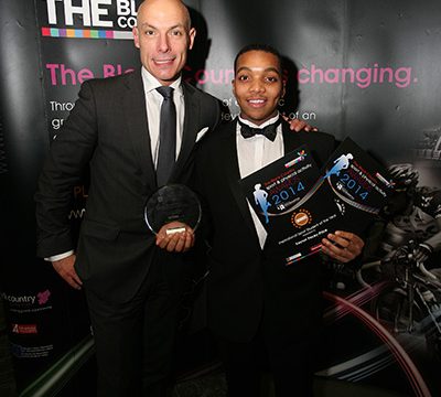 Student Keyron presented with award by referee Howard Webb