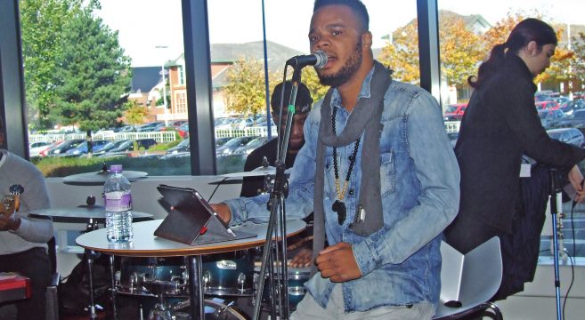 Black artist singing for Black History Month event