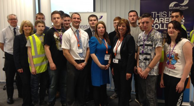 A group of construction students, staff and council employees