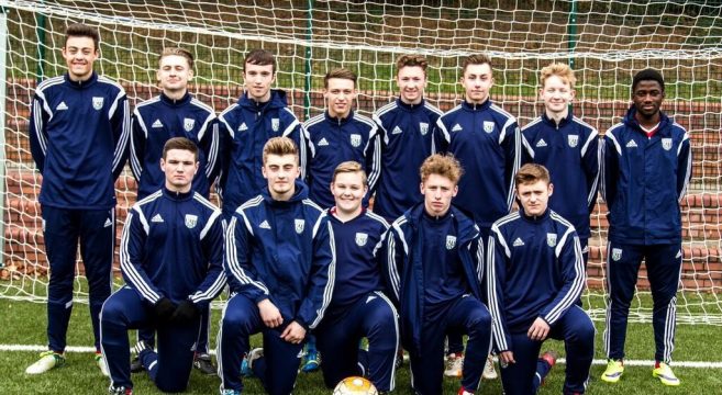 Football team photo in goal mouth