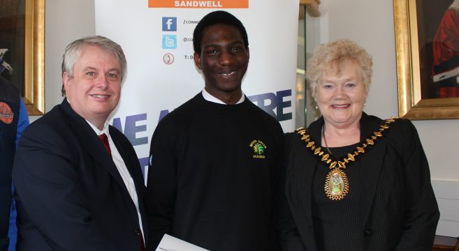 Male school student with Mayor and college principal