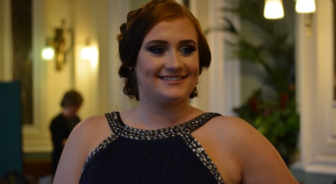 Hairdressing model in navy blue evening dress