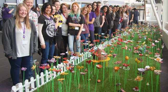 Group of students standing by Ceramic Garden at Central Campus