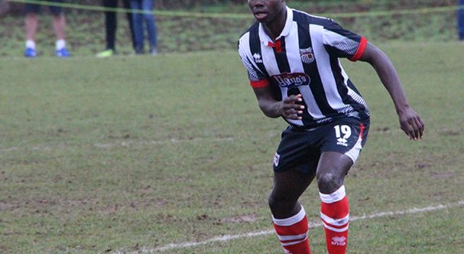 Ahkeem Rose playing for Grimsby Town in a football match