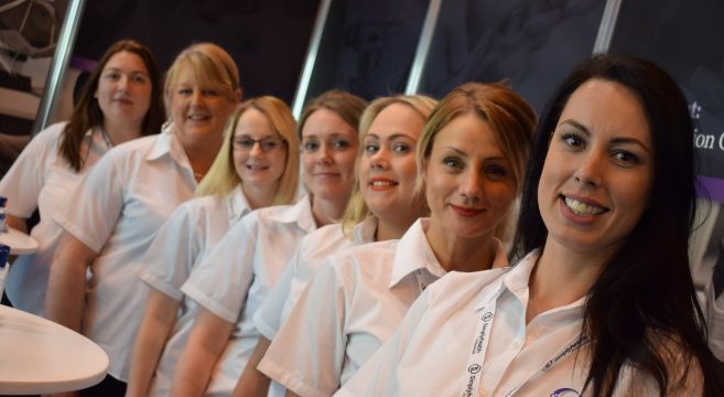 Group photo of the dental team at the NEC