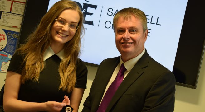 Marta with medal from Principal Graham Pennington