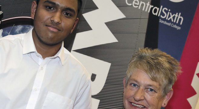 Male student receiving the Central Sixth Student of the Year award