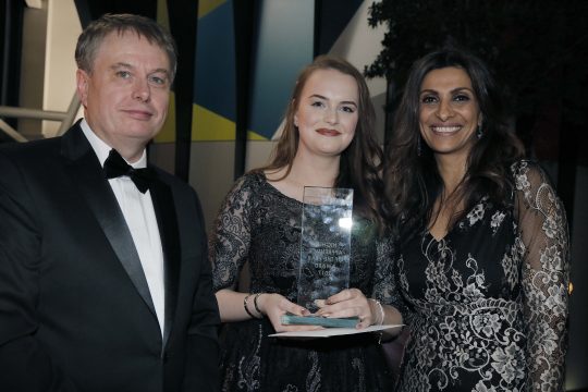 Amy Mills holding her Higher Apprentice of the Year award