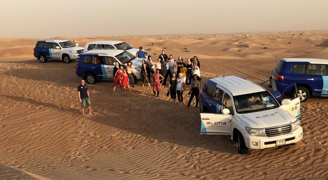 Travel students in Dubai desert