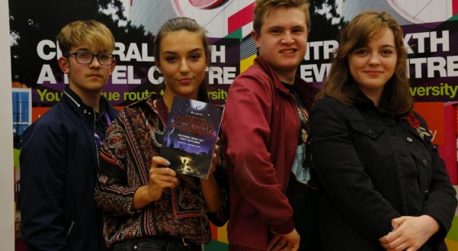 A Level students showing their published book