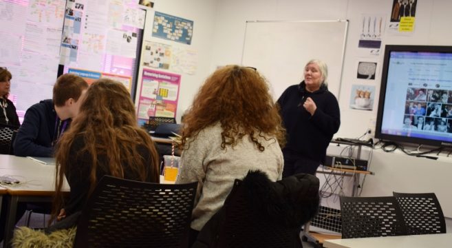 Journalist speaking to a class of students