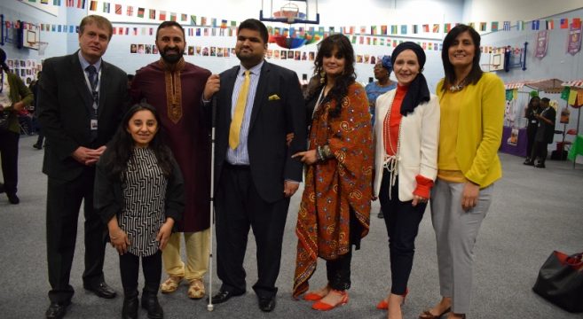 Group of staff members celebrating One World event