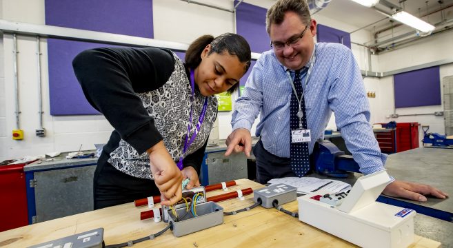 Engineering student and teacher in the classroom