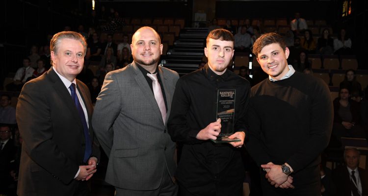 Student receiving award from Graham Pennington, Councillor Danny Millard and James Brown