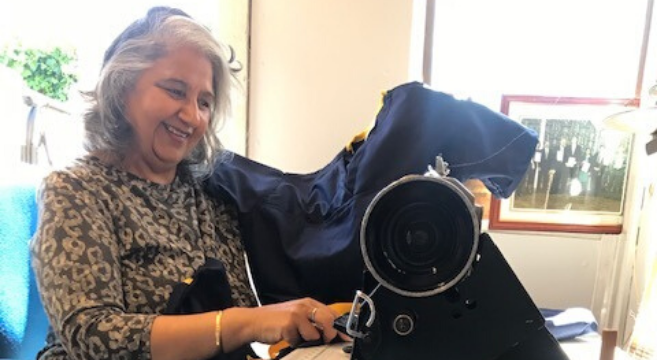ESOL lecturer using textiles equipment