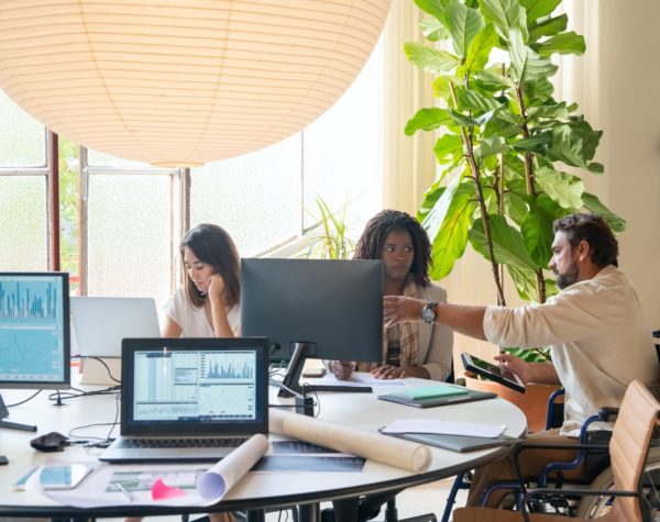 group working around computers