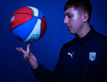 Sport student playing basketball