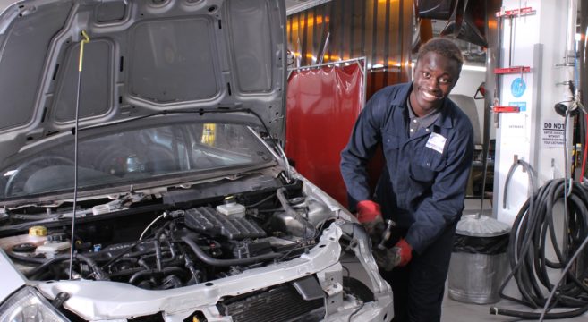 Automotive student working on car