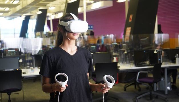 Female student using VR equipment