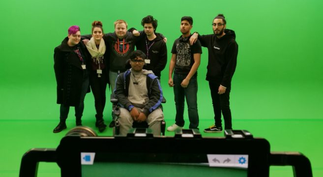 Media students standing in front of green screen