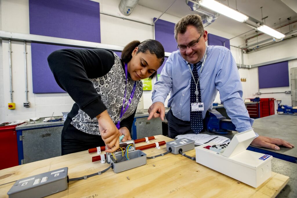 Engineering student and teacher in the classroom