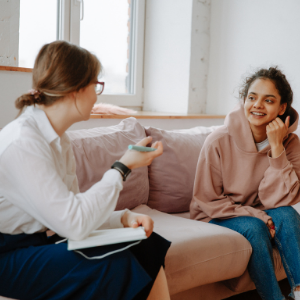 Counsellor speaking to young woman
