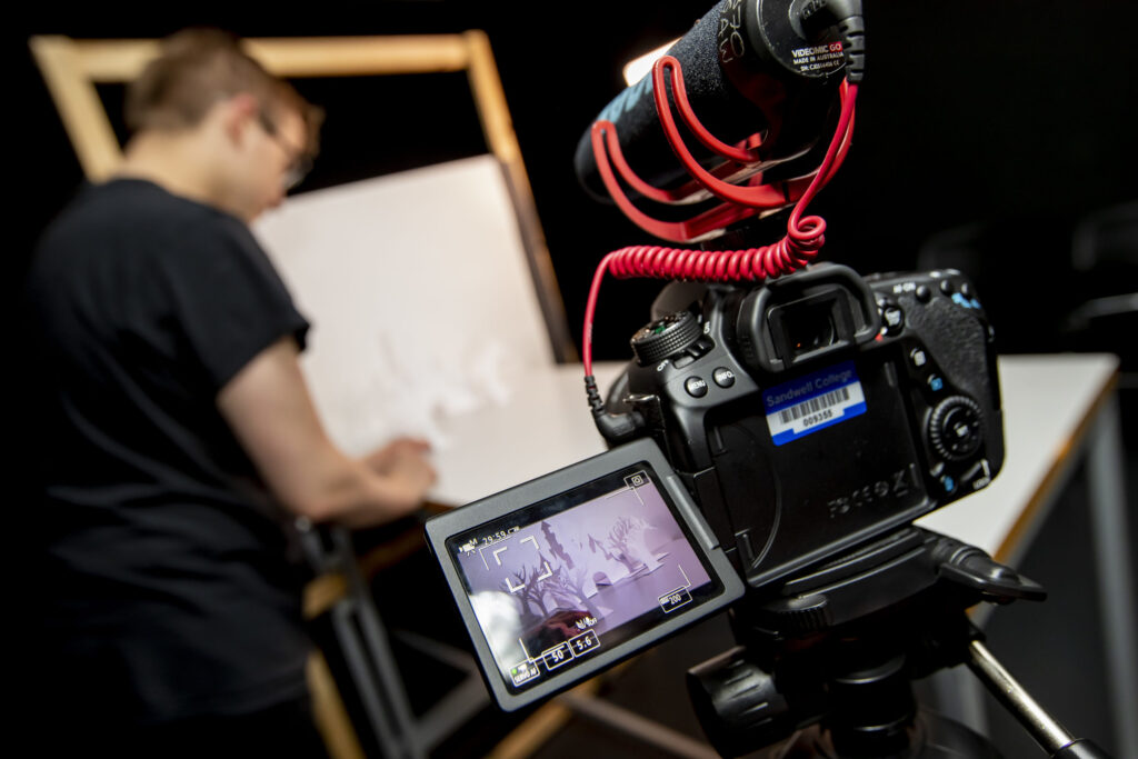 TV camera filming student