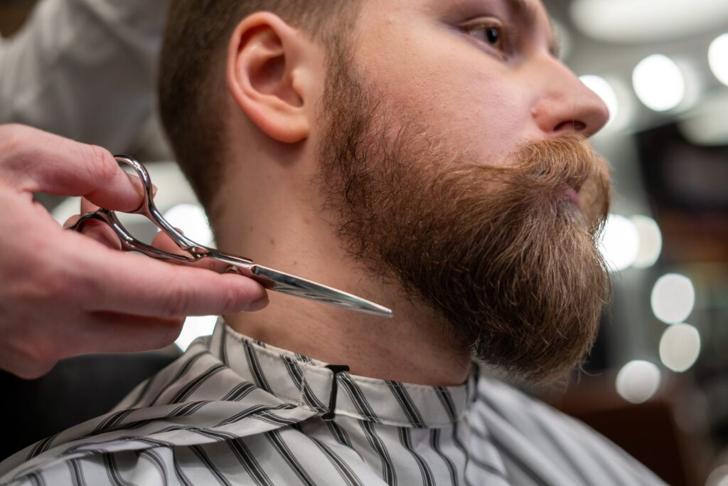 Man having his beard trimmed