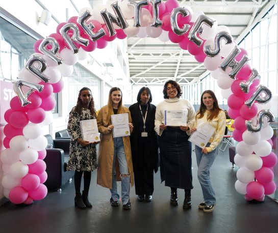Star Apprentices standing together under a balloon arch