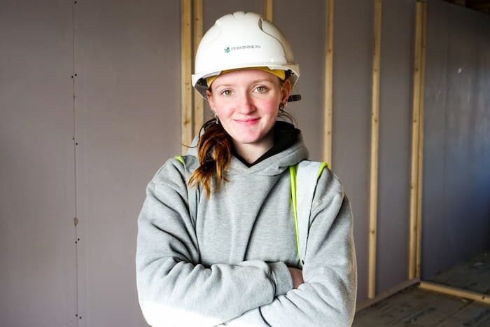 Female construction apprentice in hard hat