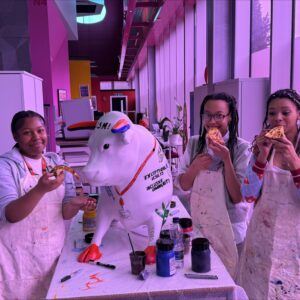 CSM students having a pizza party to paint the calf