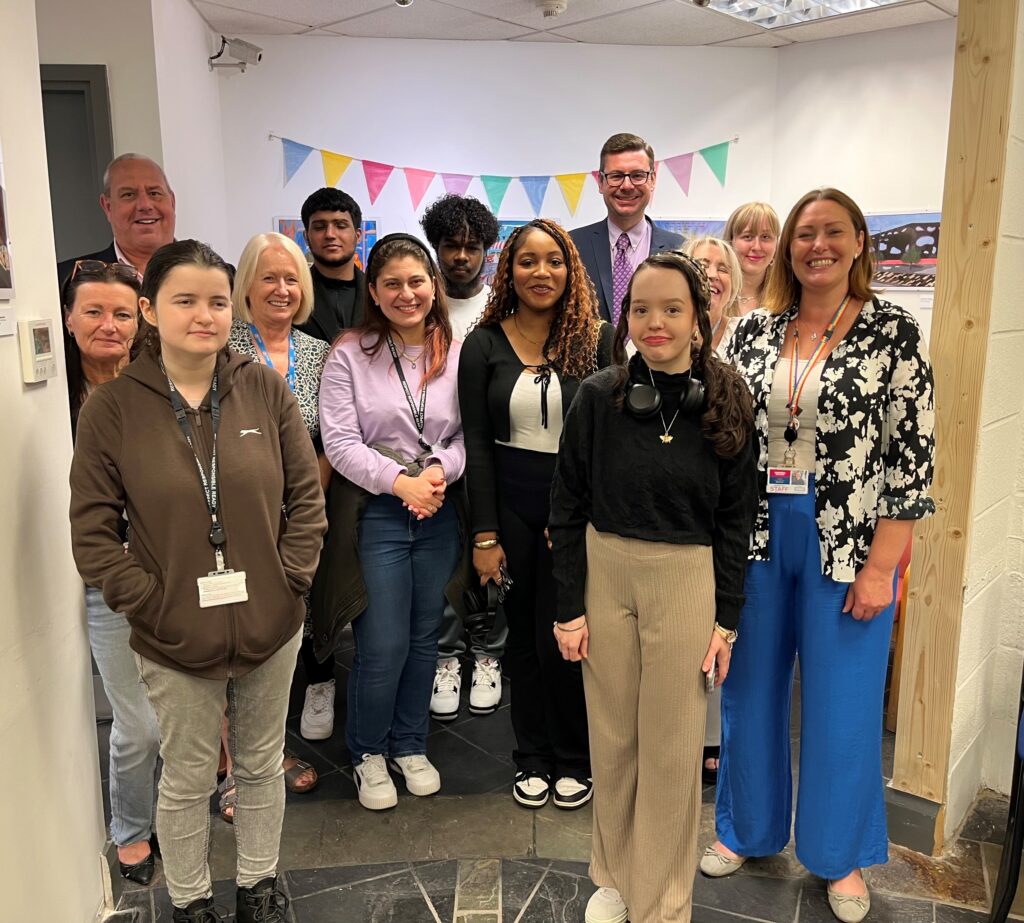 Students and staff smiling at Community Hub Launch