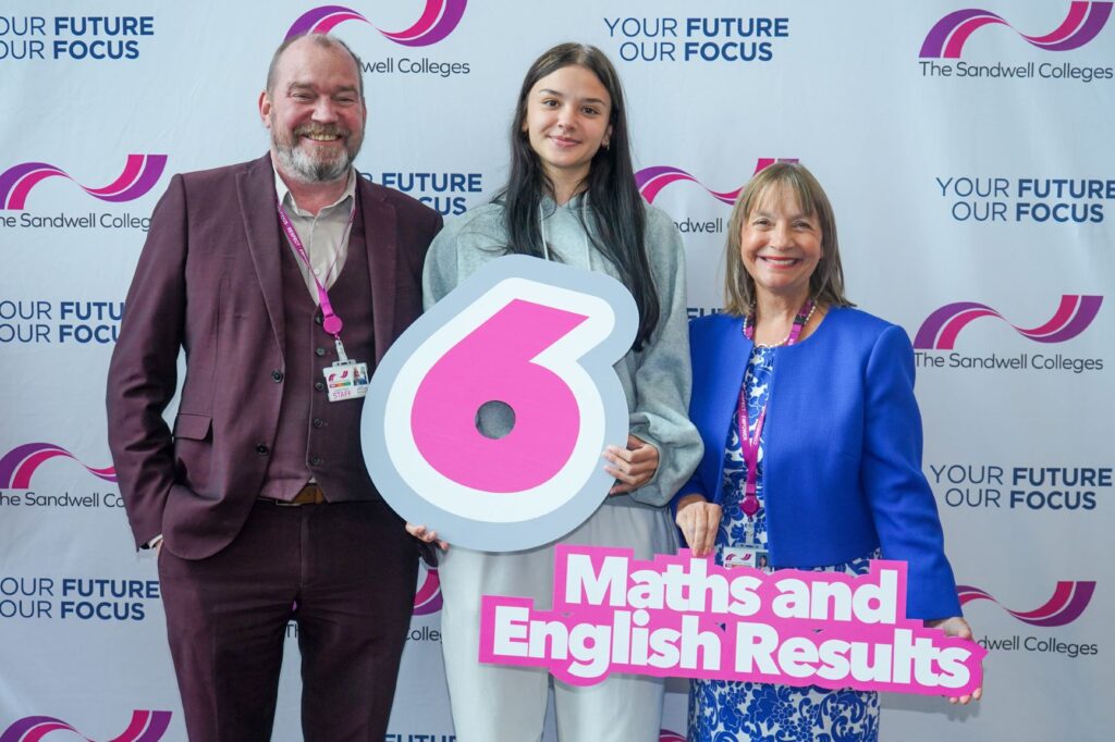 GCSE student celebrating her grade 6 with staff and principal