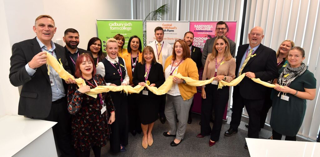 Senior college leaders holding the yellow Sandwell Silk of Well-being