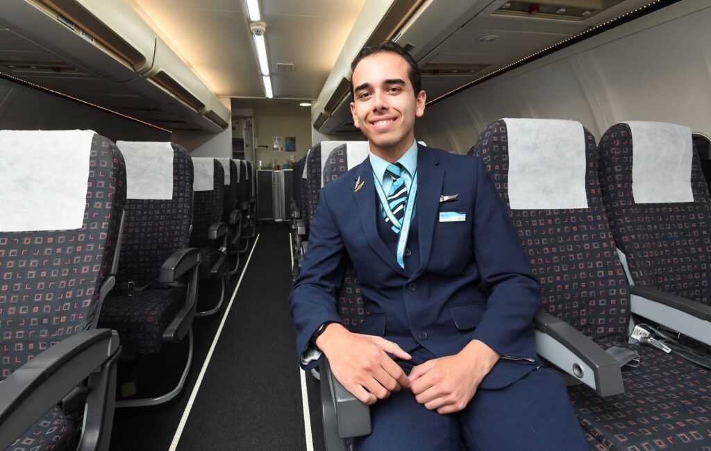 Travel alumnus Sammy now working for TUI sitting in the college cabin