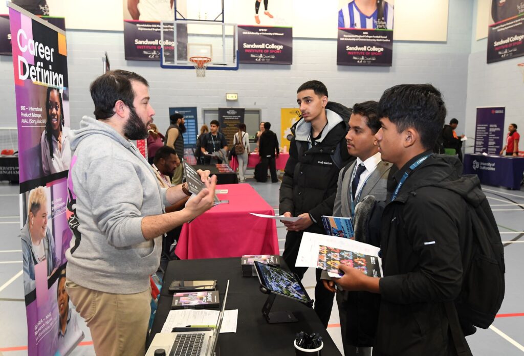 Students getting information at a Higher Education Fair