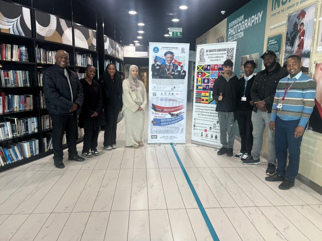 Six students by exhibition banner with project director Donald Campbell and Computing Lecturer