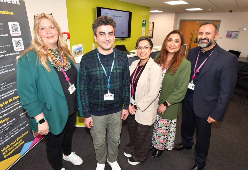 ESOL student with college staff