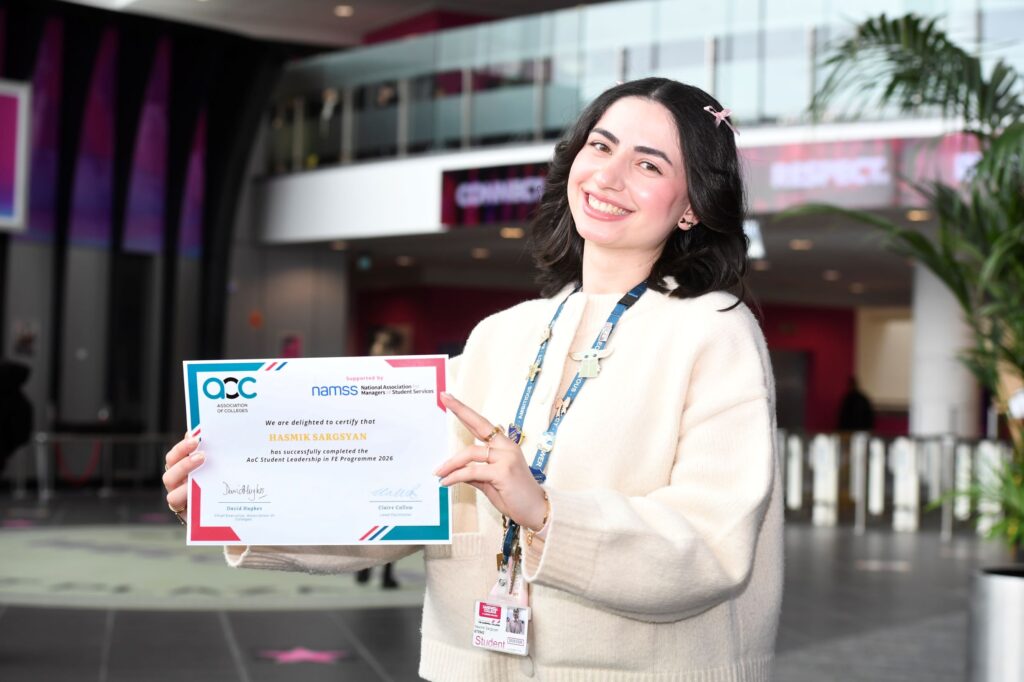 Student Union president Hasmik holding her certificate