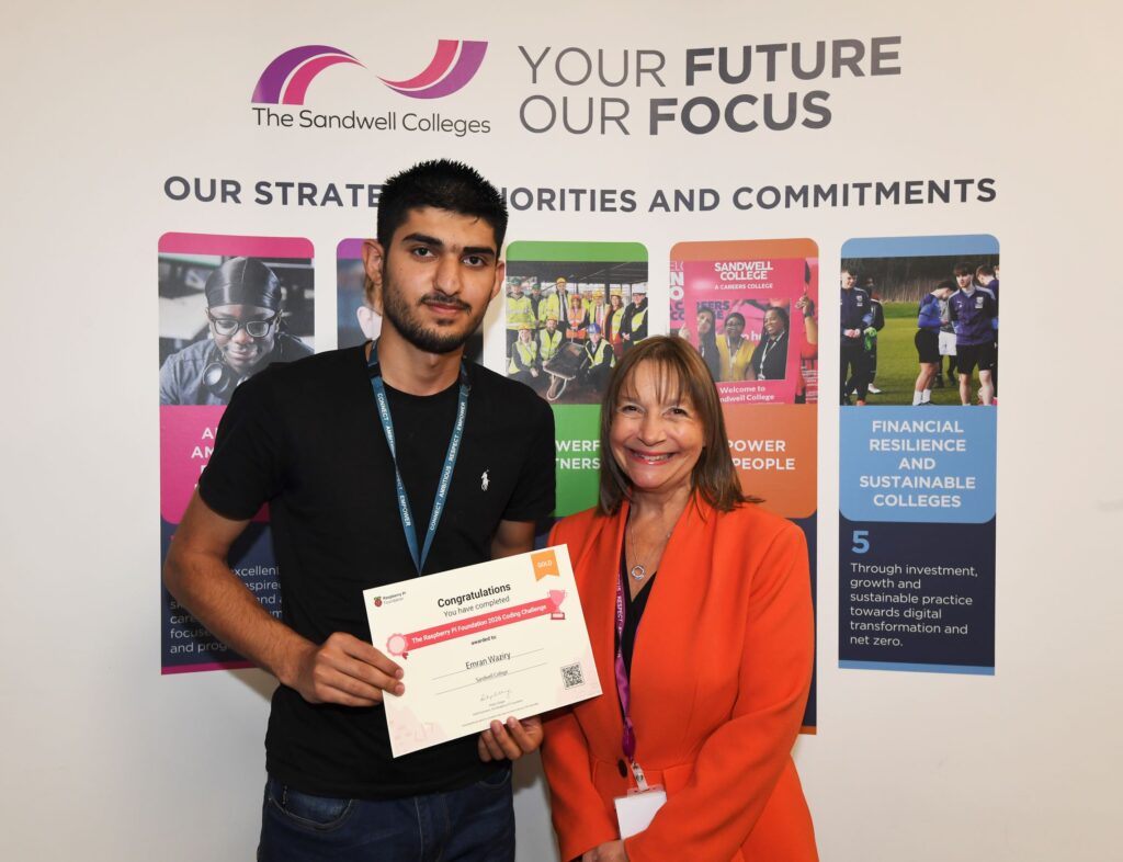 Raspberry Pi challenge winner with his certificate standing with the college principal