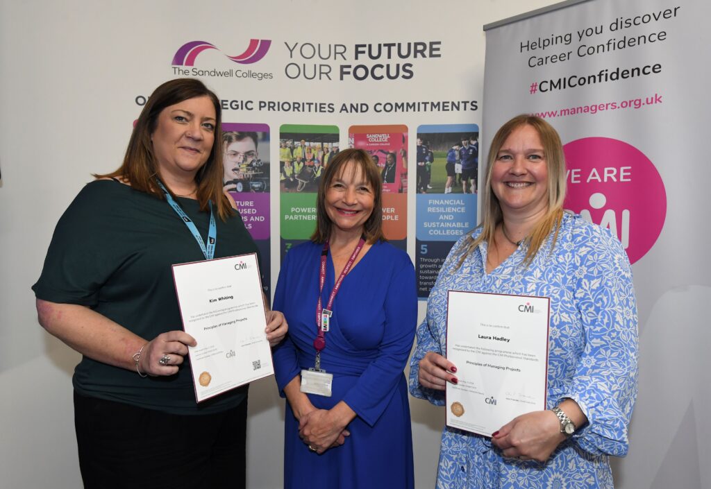 Two CMI award recipients with college principal